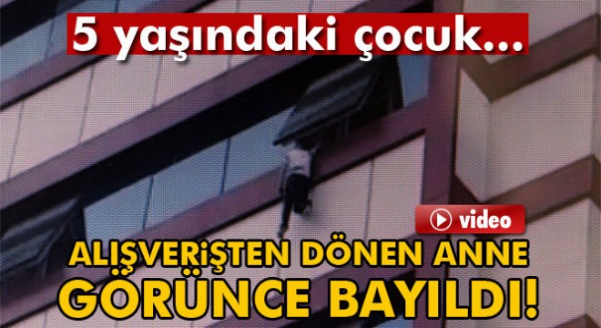 Pencerede asılı kalan çocuk son anda düşmekten kurtuldu